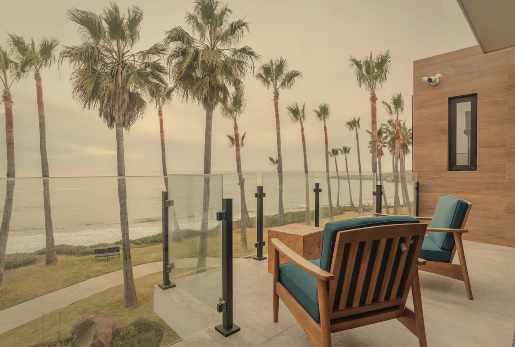 Baja California Beach Home terrace with palm trees and ocean