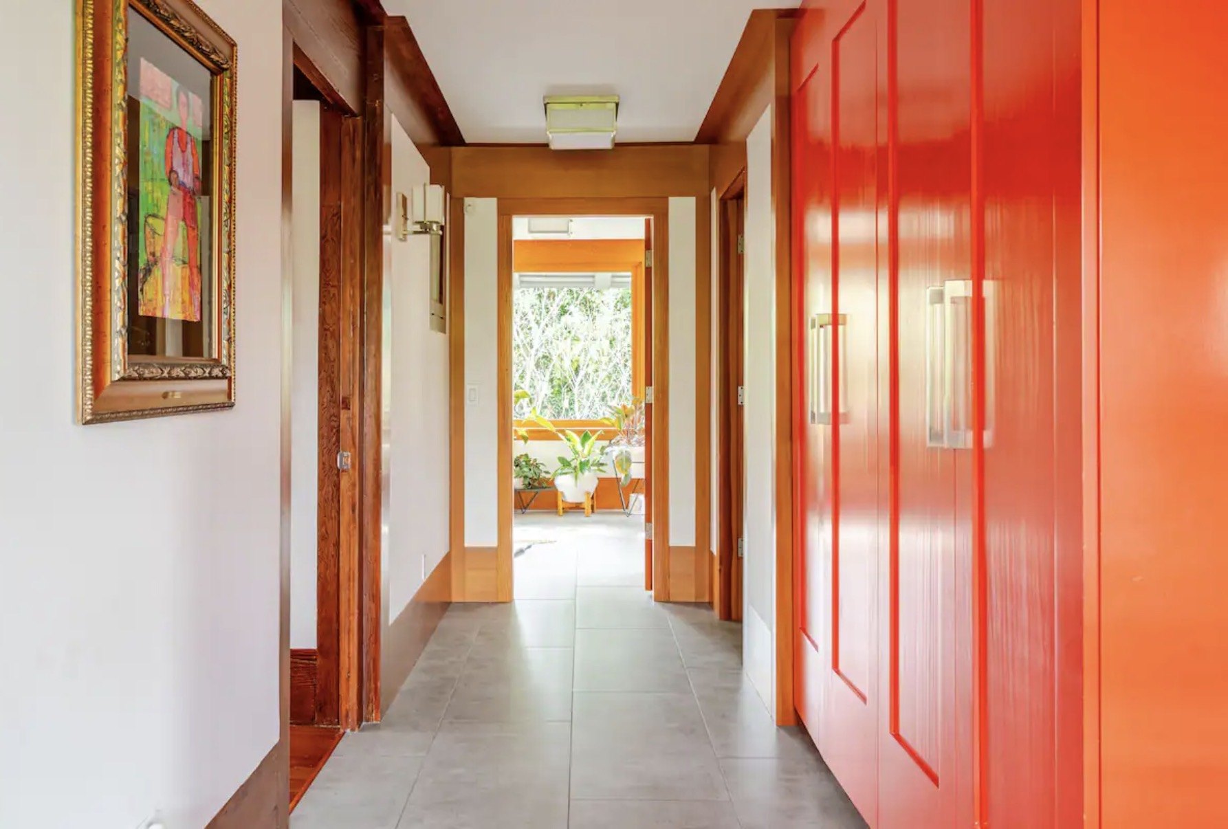 Red custom cabinetry in a historic home hallway